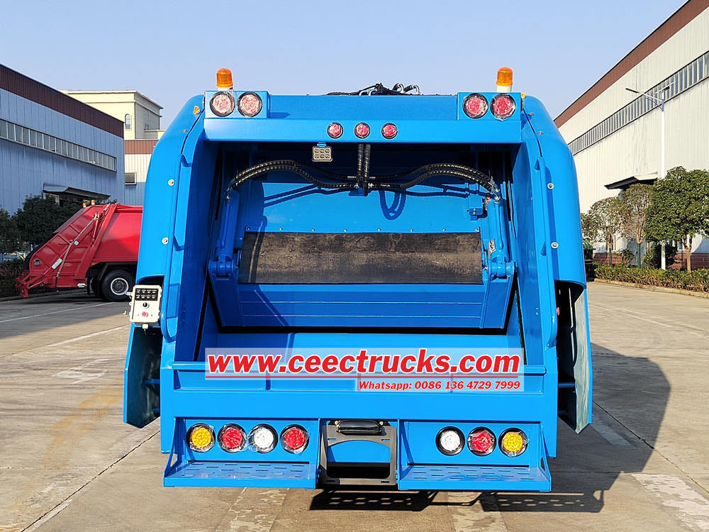 Isuzu trash compactor truck