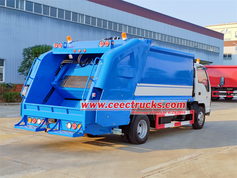 Isuzu NKR trash compactor truck